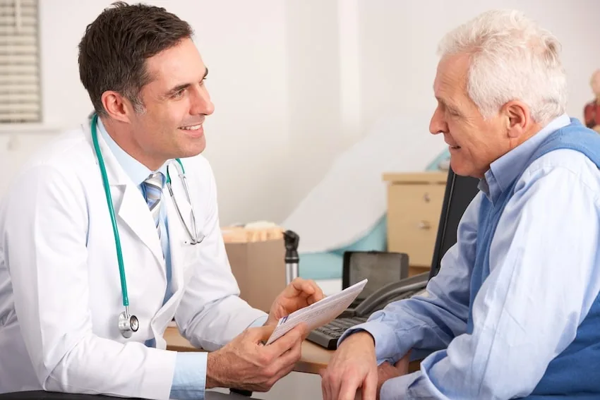A doctor reviewing a neuropathy treatment plan with an older patient