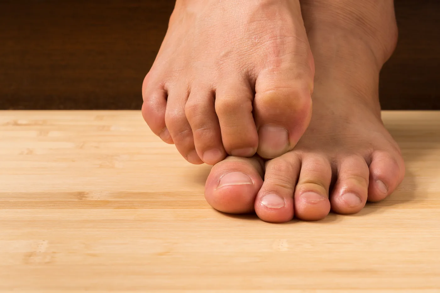 Close-up of bare feet, where peripheral neuropathy symptoms most often begin